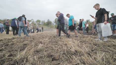 demonstration of agricultural machinery at an exhibition. tractors operate in the field, showcasing their capabilities and performance in action