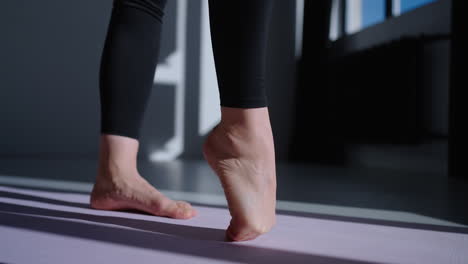 woman practicing yoga in a studio