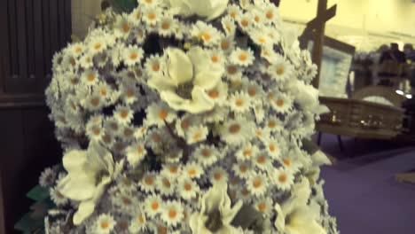 luxurious wreaths of artificial flowers to decorate coffins at the exhibition