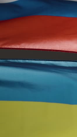 vertical shot of ukrainian and russian flags 02