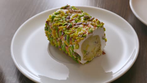 sweet pistachio dessert on a white plate