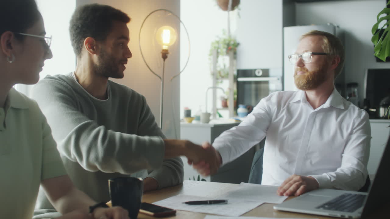 Couple Signing Agreement with Financial Planner