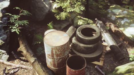 old used wheels in the tropical forest as pollution concept