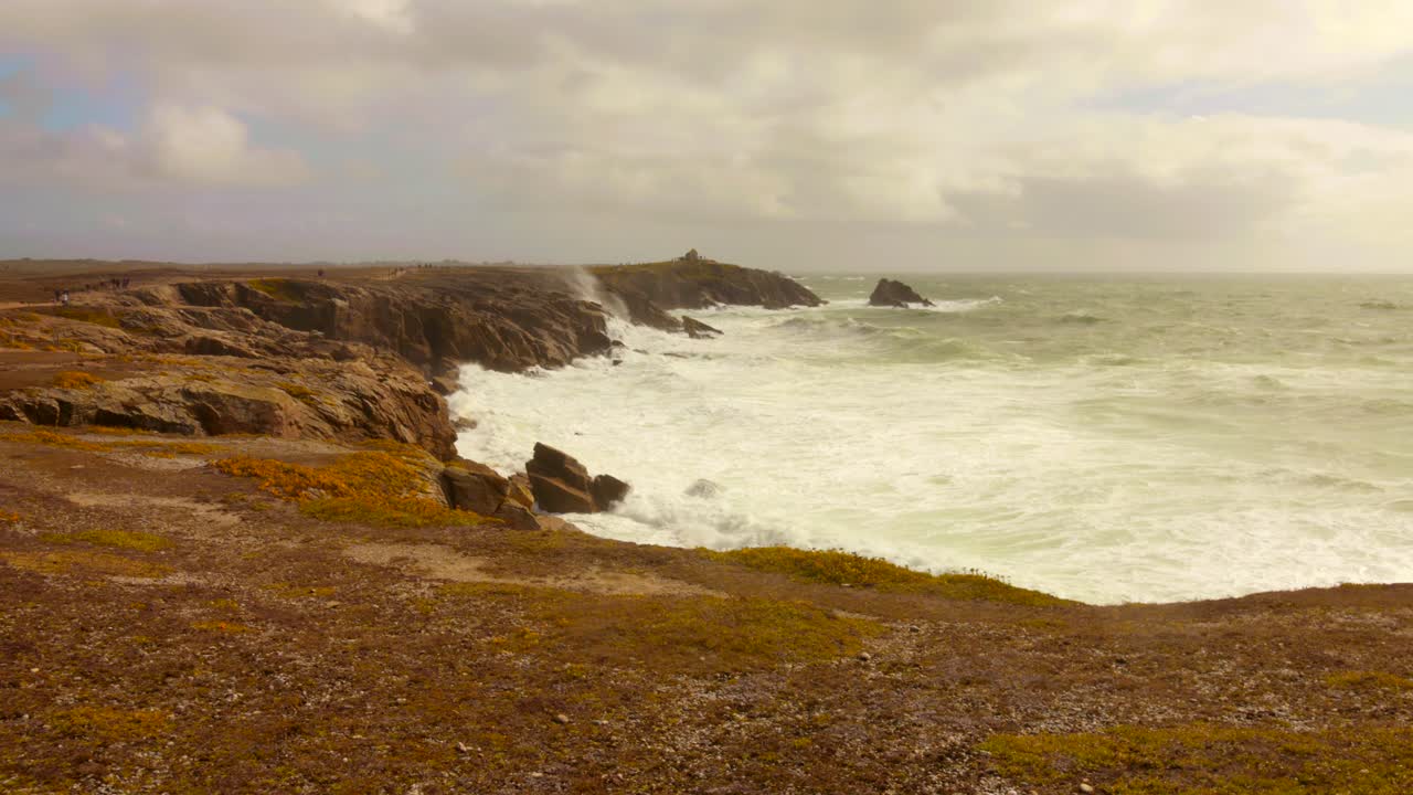 Experience the breathtaking wild coast of Quiberon, Brittany, with its dramatic cliffs and powerful waves. Shot from a scenic vantage point, this footage captures the raw beauty of the Atlantic Ocean