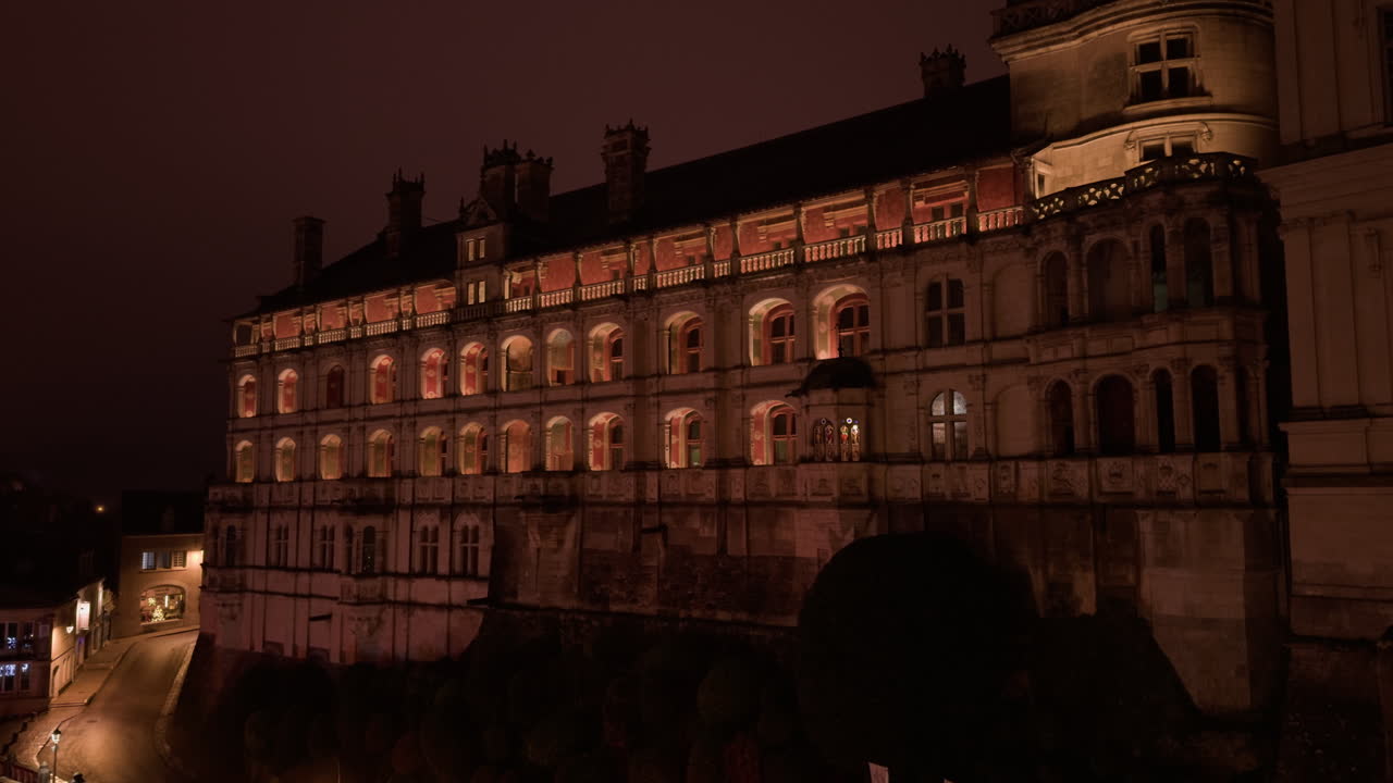 Profile view of Royal castle of Blois, France during nighttime. Sight seeing.
