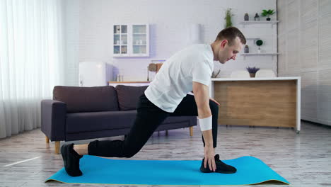 man indoor doing exercise in quarantine. home working out by healthy strong man.