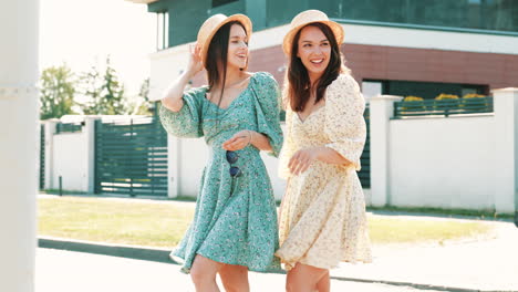 two women in floral dresses