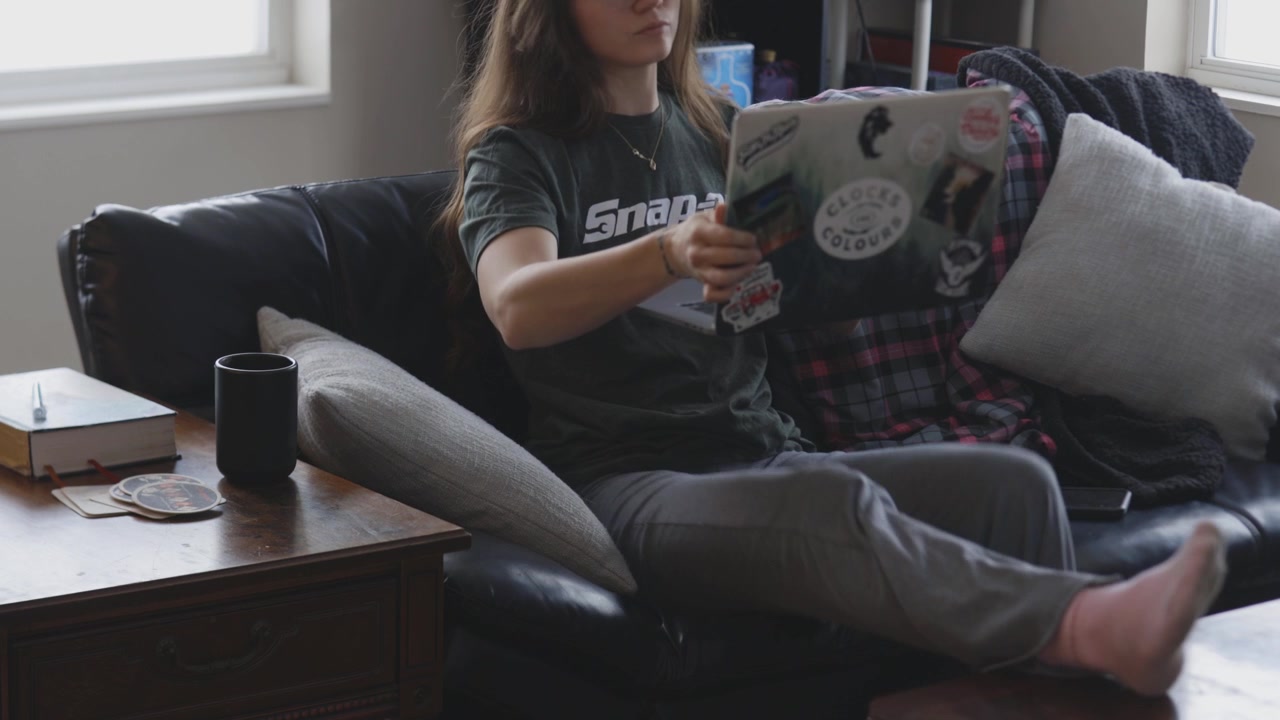 Remote worker engaged on a computer in an apartment.