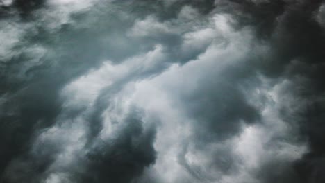 point of view, a dark cumulus gray cloud with a thunderstorm in it moved across the sky