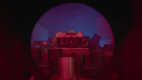vintage camera in a neon-lit studio