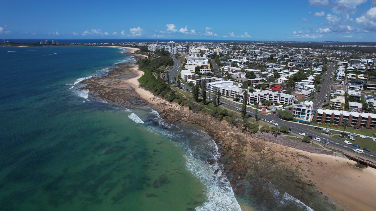 Beachside Hotels At Alexandra Headland Beach On The Sunshine Coast Of Queensland, Australia. Aerial Pullback Shot