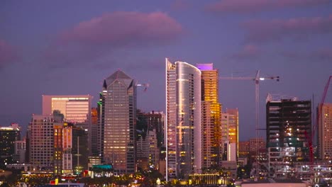 san diego skyline lit up at sunset