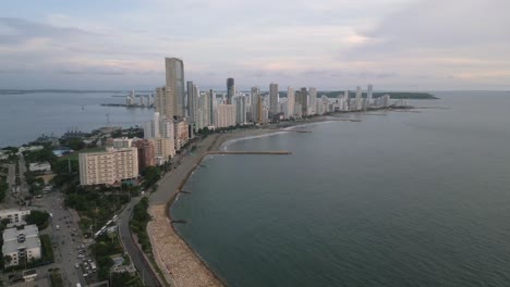 aerial looking towards the playa de bocagrande beach and city at dusk in cartagena, boliviar, colombia