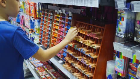 vinnitsa, ukraine - august, 2018: back to school concept. purchase of stationery in the store.