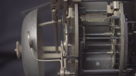 an antique vintage clock with the tick-tock mechanism movement