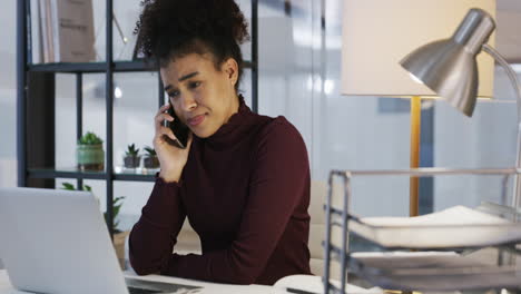 a young businesswoman looking unhappy while using