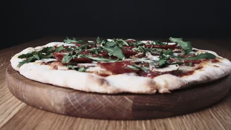 appetizing pizza on a wooden board in a restaurant