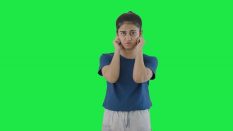 Indian-teenage-girl-saying-sorry-and-apologizing-Green-screen