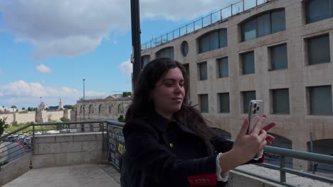 woman taking a selfie in jerusalem