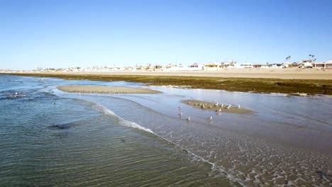 Aerial,-arc-around-the-small-sand-bars-being-to-appear-as-the-tide-goes-out,-Puerto-Peñasco,-Rocky-Point,-Gulf-of-California,-Mexico