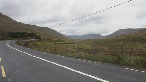 road through the mountains of ireland in summer