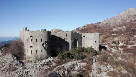 AERIAL---Fort-Kosmac-and-the-Adriatic-Sea,-Montenegro,-spinning-shot