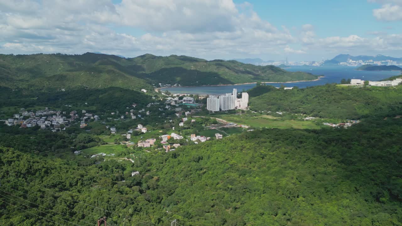 Footage of Mui Wo, a rural town on Lantau Island in Hong Kong, featuring coastal scenery, traditional buildings, lush greenery, and the serene lifestyle of this eastern coastal town