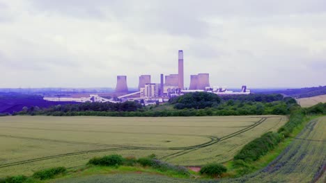low-level aerial of power station as a point of interest with a left to right panning