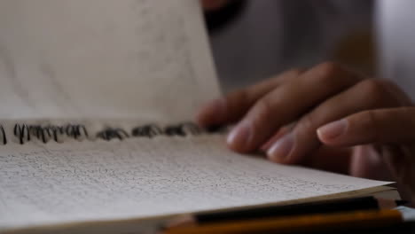 writing in a notebook