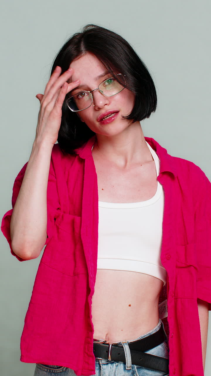 Woman sighs with disappointment covering face expressing sadness after failure or bad news reaction