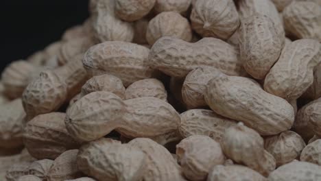 rotation of peanuts. peanuts are unpeeled in the skin