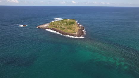 cook island in tasman sea in nsw, australia - aerial drone shot