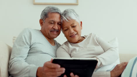 Senior-couple,-relax-and-tablet-on-sofa-in-home