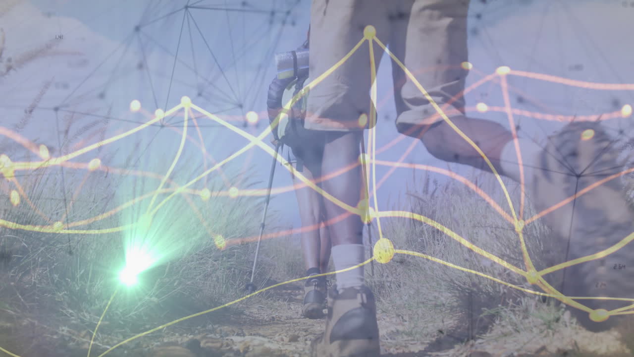two hikers trekking along grassy hillside using glowing data network mapping route for outdoor tech