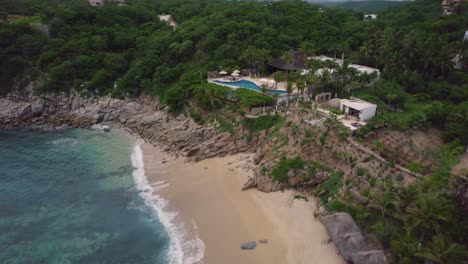 Aerial-portraying-landscape-along-the-mesmerizing-coastline-in-Huatulco,-Mexico