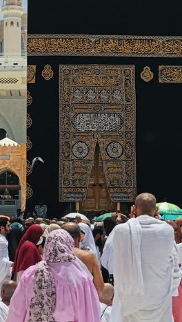 pilgrims engaged in tawaf within the mataf at masjid al haram, the holy mosque in makkah city, saudi arabia