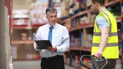 warehouse worker talking with his manager