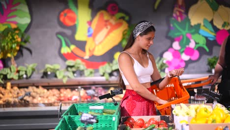 woman shopping for produce at a grocery store