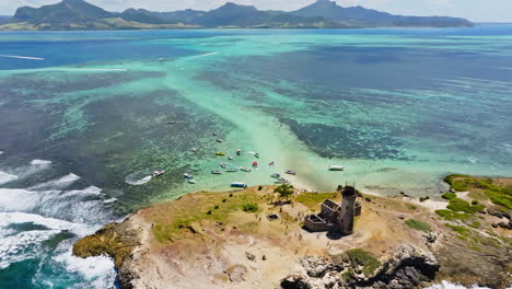 aerial drone view of a lighthouse on ile aux fouquets, ile au phare, bois des amourettes, mauritius