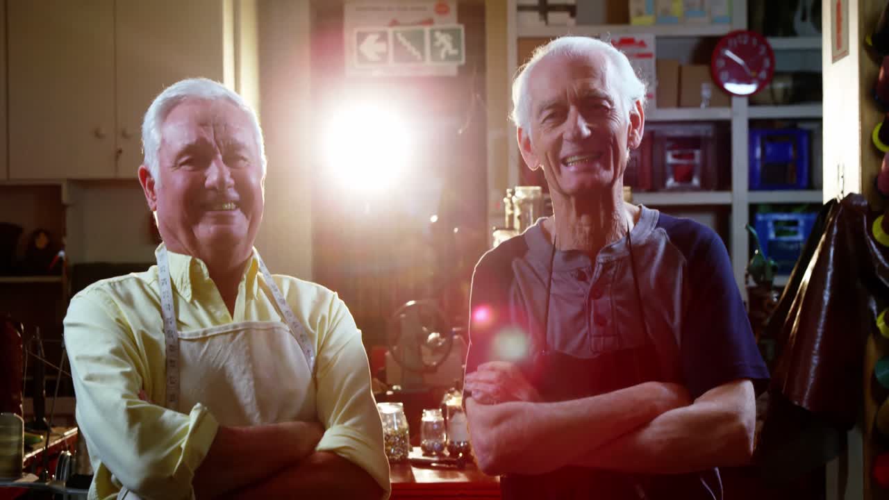 Portrait of shoemaker standing with arms crossed