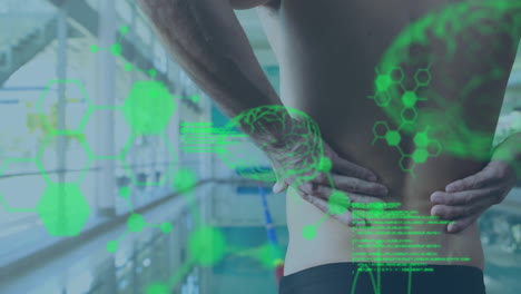 Holding-lower-back,-person-experiencing-pain-with-medical-data-animation-overlaid