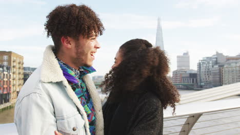 young tourist couple visiting london in winter