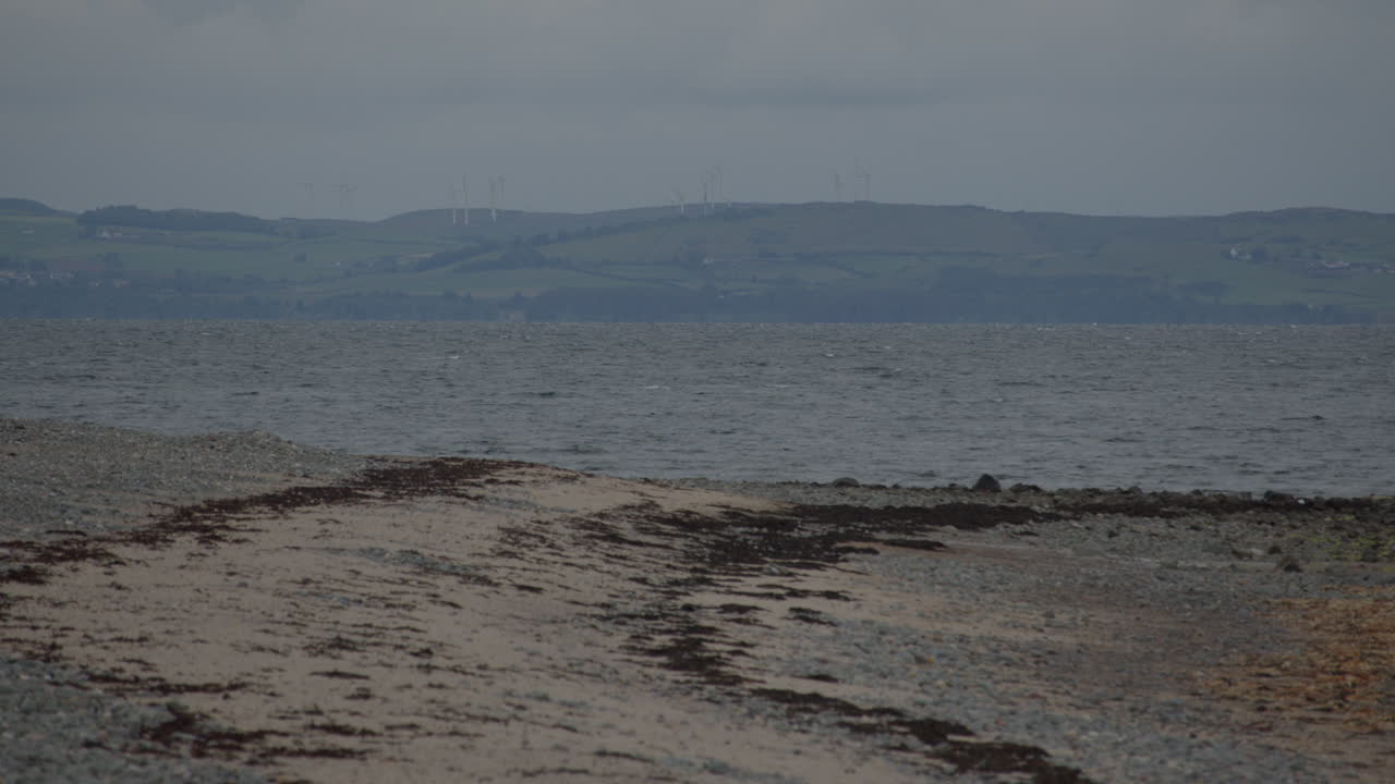 Looking across luce bay with luce sands in background and New England Bay Beach in foreground