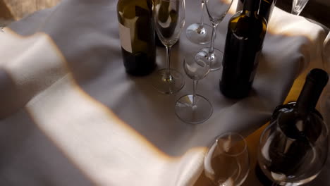 wine bottles and glasses on a table