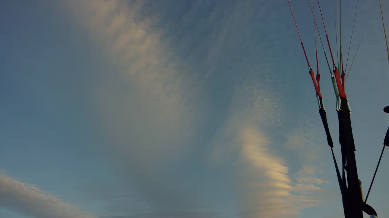 Paragliding Gear Against a Cloudy Sky
