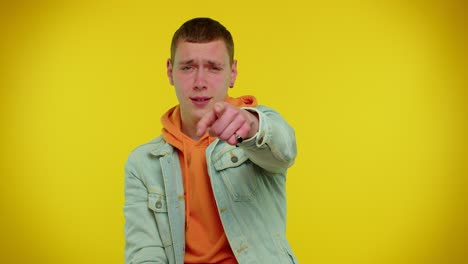 man smiling excitedly, pointing to camera, beauty choosing lucky winner, indicating to awesome you