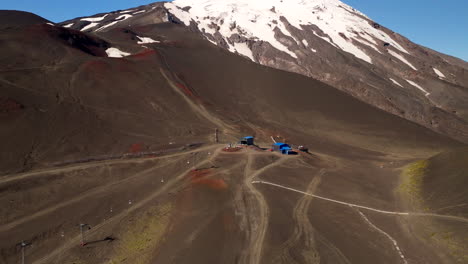 osorno volcano ski station, snow-capped peak, barren and reddish-brown volcanic slopes, landscape, chile