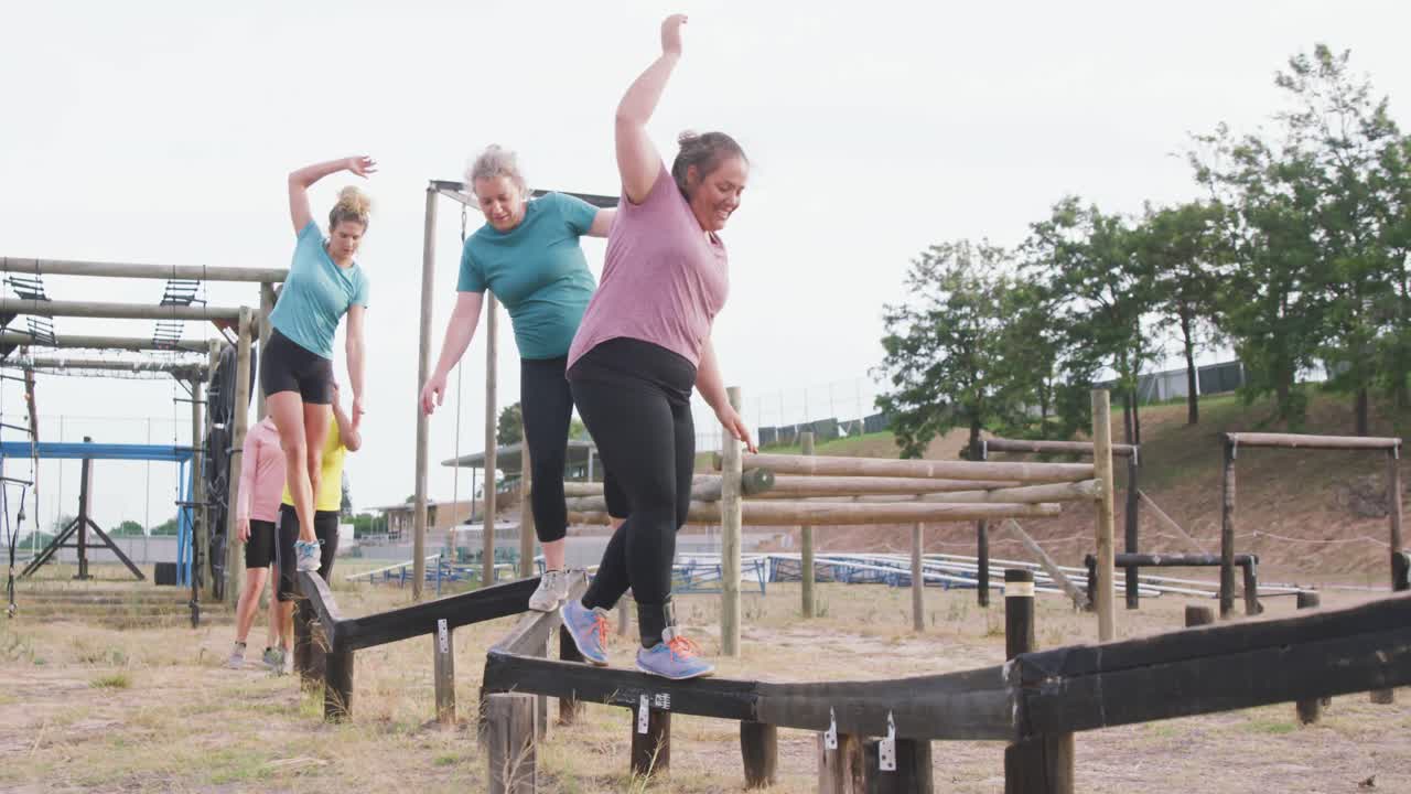 Caucasian women exercising at bootcamp