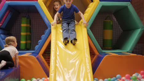 kids playing in a ball pit