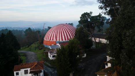 Drone-descends-through-trees-to-split-in-road-around-Benposta-tent-in-Ourense-Spain